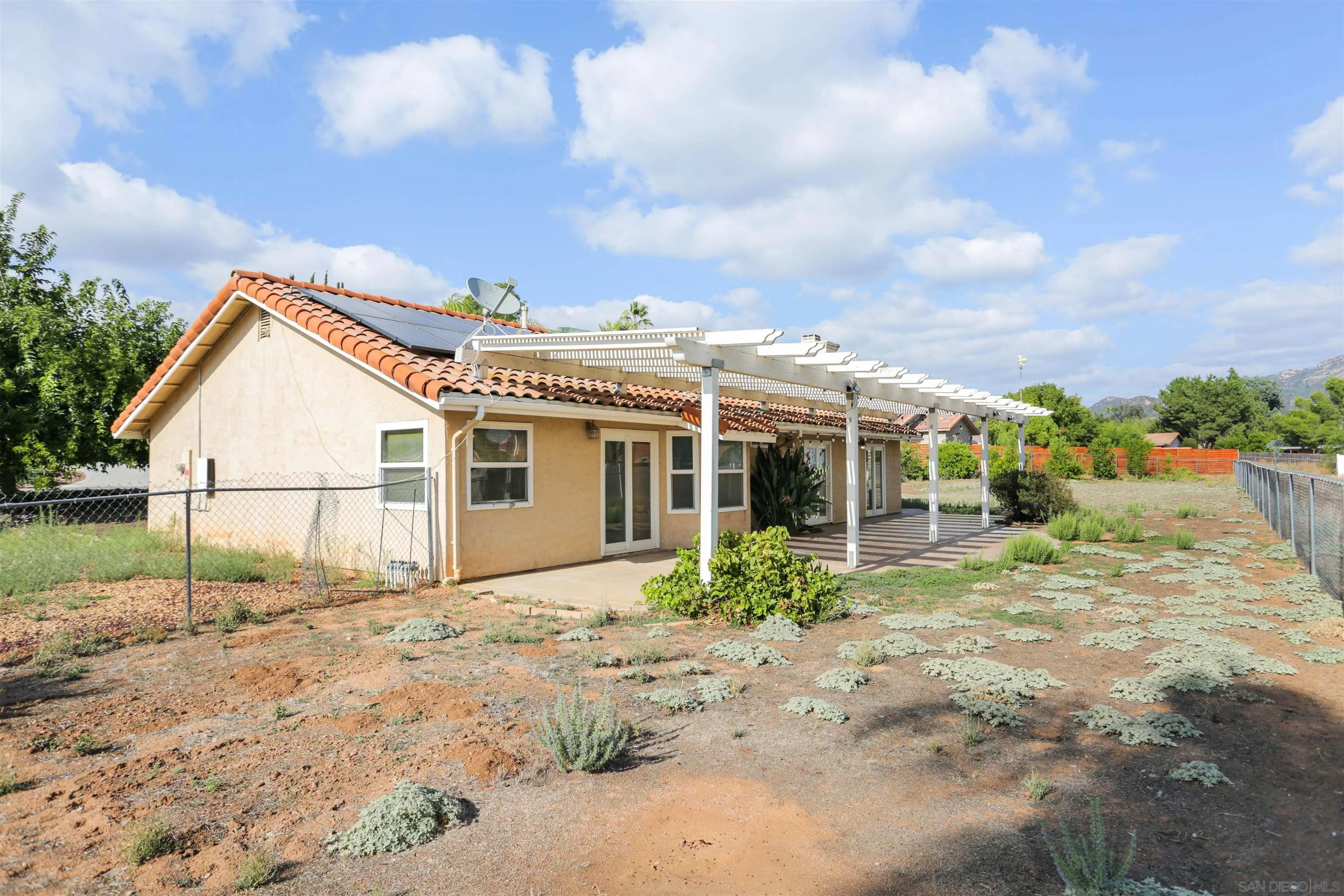 23641 Springwood Drive Ramona, CA 92065 - Photo 30 of 34 a view of a house with backyard