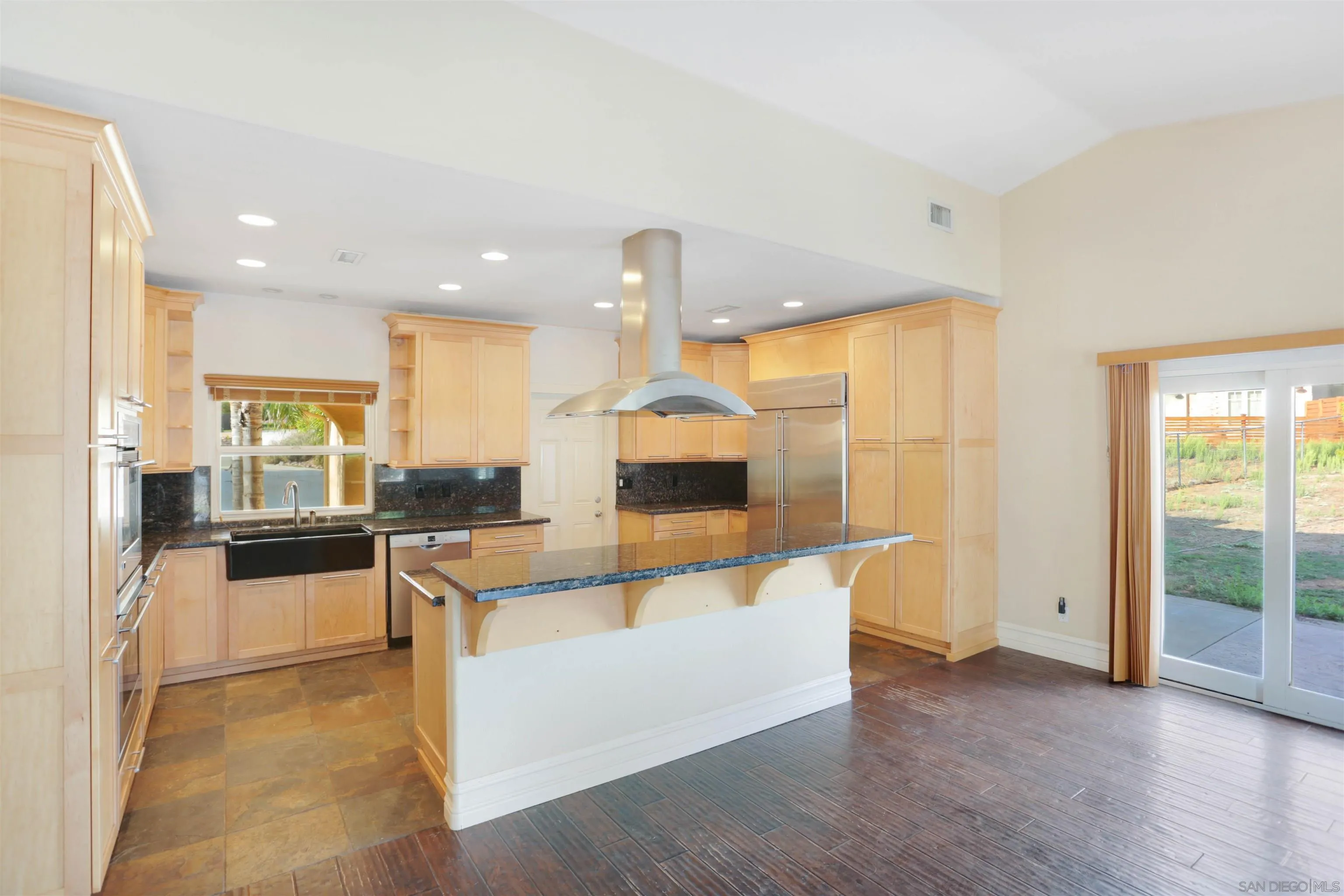 23641 Springwood Drive Ramona, CA 92065 - Photo 4 of 34 a large living room with stainless steel appliances kitchen island granite countertop a large kitchen counter top and stove