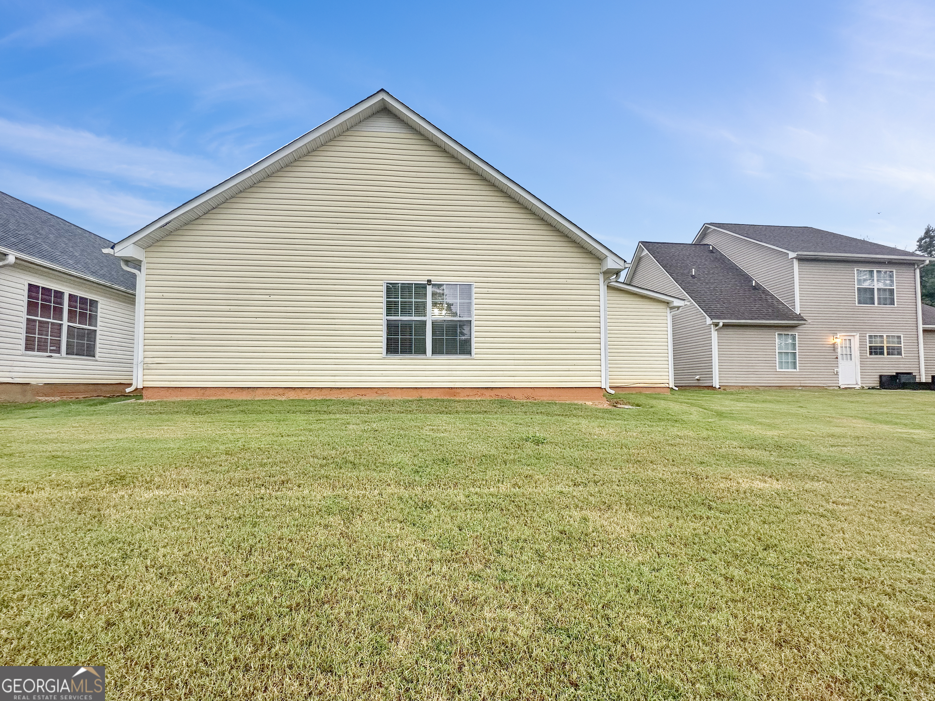 400 Crestfield Circle Covington, GA 30016 - Photo 15 of 16 a view of a house with a backyard
