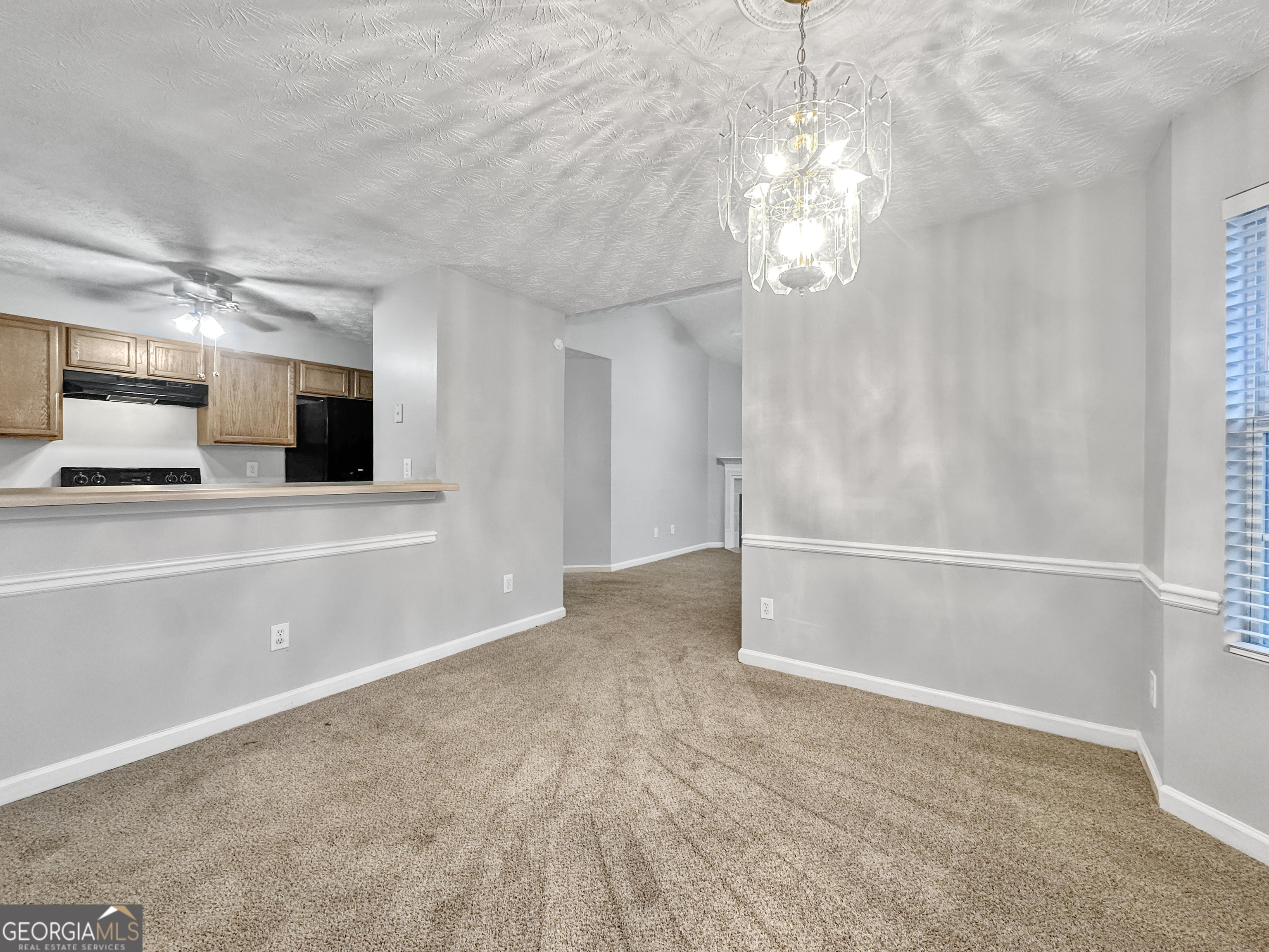 400 Crestfield Circle Covington, GA 30016 - Photo 5 of 16 a view of a livingroom with a flat screen tv