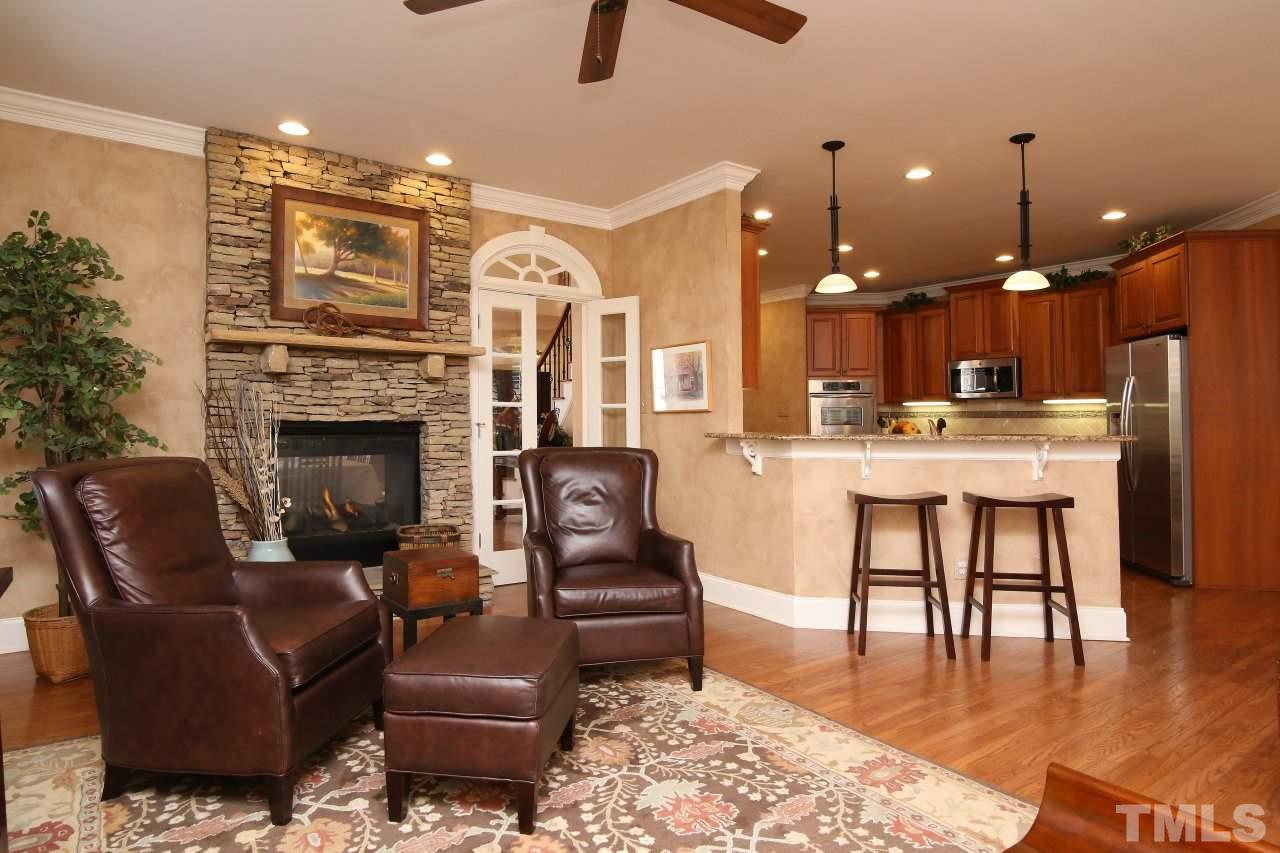 1841 Torrington Street Raleigh, NC 27615 - Photo 11 of 25 a living room with furniture and a fireplace