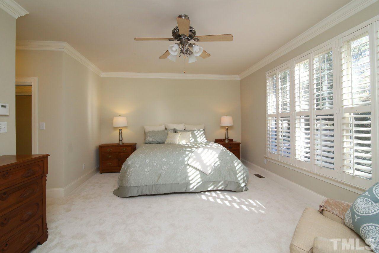 1841 Torrington Street Raleigh, NC 27615 - Photo 12 of 25 a bedroom with a bed and window