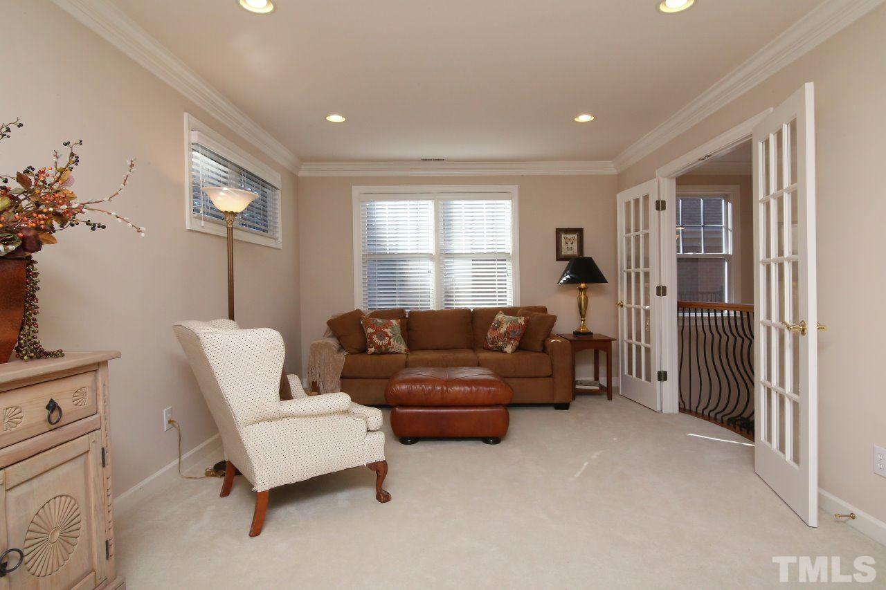 1841 Torrington Street Raleigh, NC 27615 - Photo 17 of 25 a living room with furniture and a window