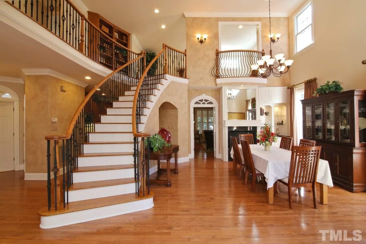 1841 Torrington Street Raleigh, NC 27615 - Photo 3 of 25 a dining room with furniture entryway and wooden floor