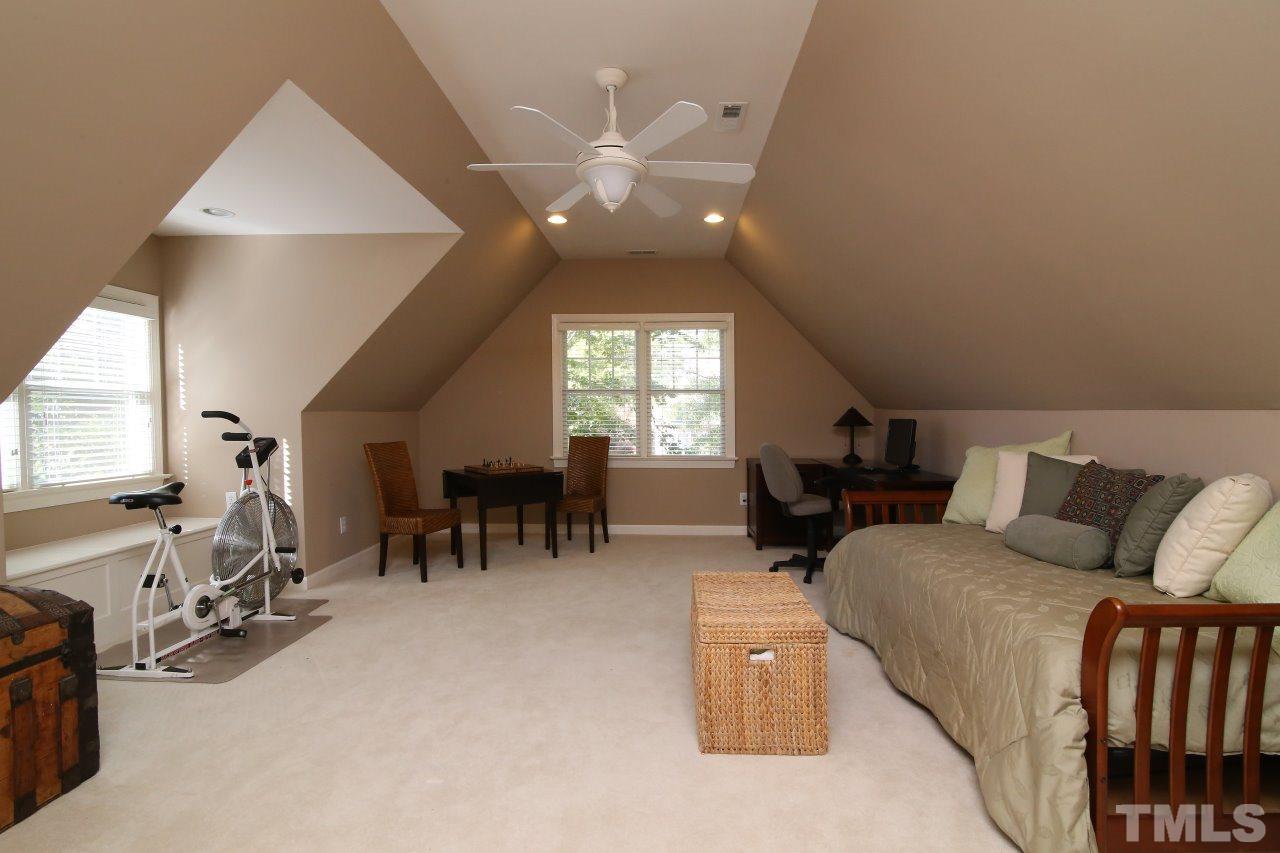 1841 Torrington Street Raleigh, NC 27615 - Photo 21 of 25 a living room with furniture a chandelier and a large window