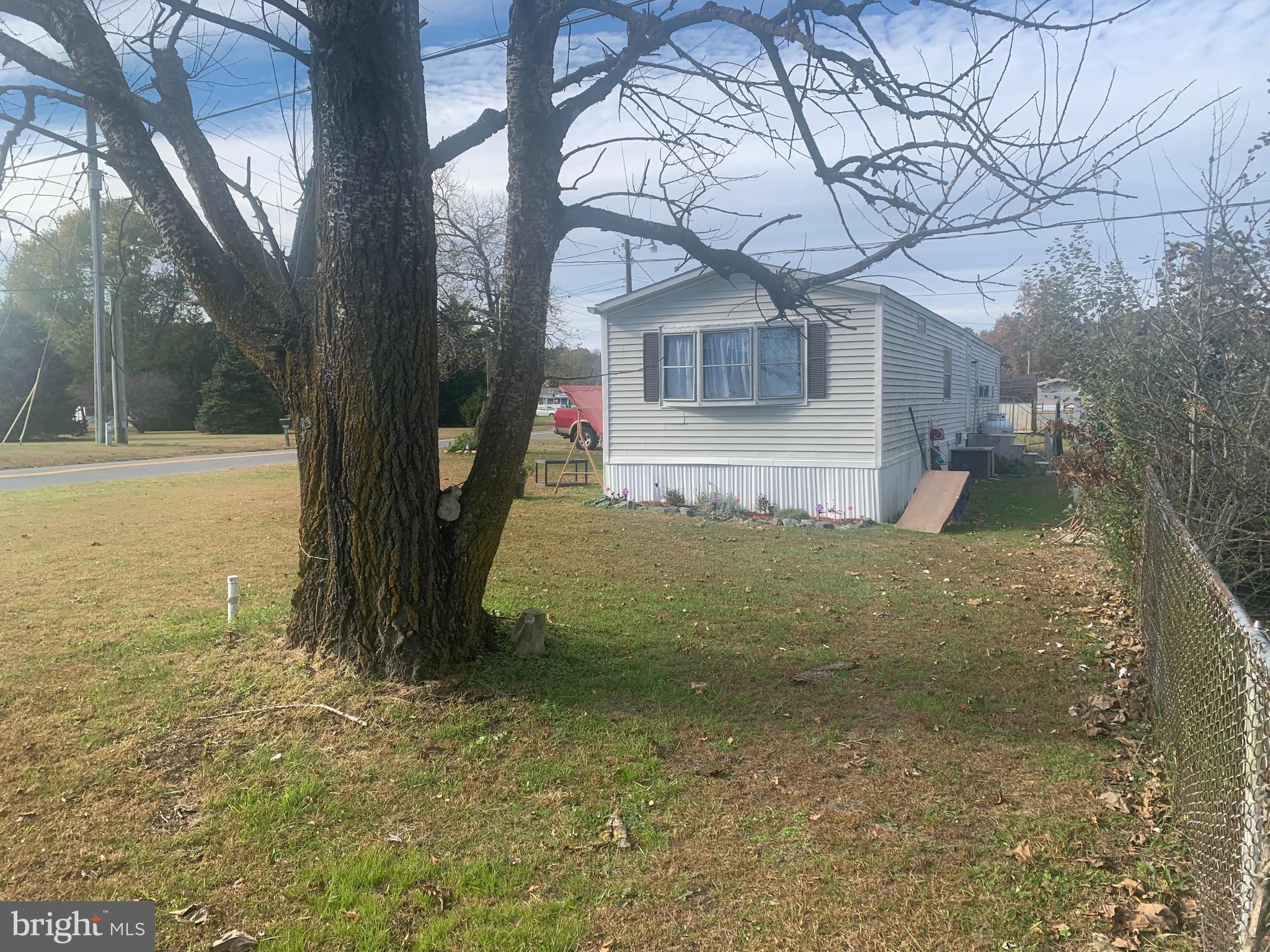 18141 McColleys Chapel Road Georgetown, DE 19947 - Photo 2 of 5 a view of a house with a yard