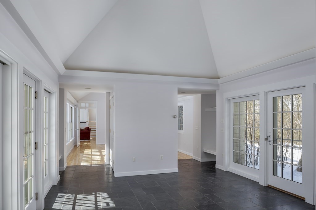 18 South Shaker Road Harvard, MA 01451 - Photo 12 of 36 a view of a hallway with wooden floor and a living room