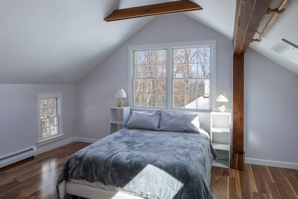 18 South Shaker Road Harvard, MA 01451 - Photo 18 of 36 a bedroom with a large bed and a window