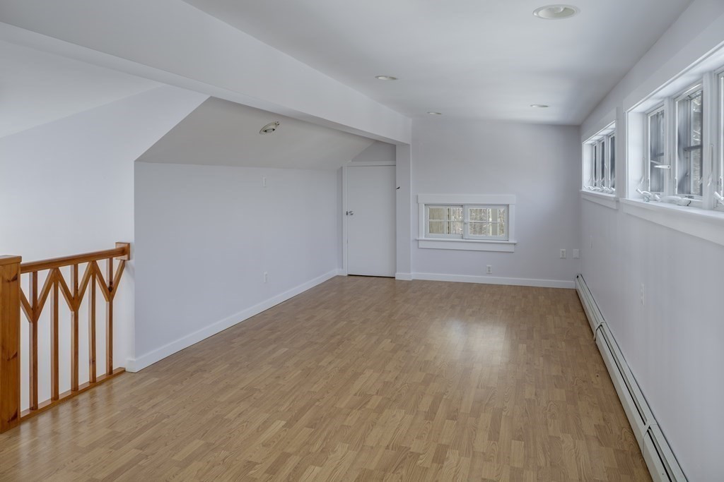 18 South Shaker Road Harvard, MA 01451 - Photo 20 of 36 a view of empty room with windows