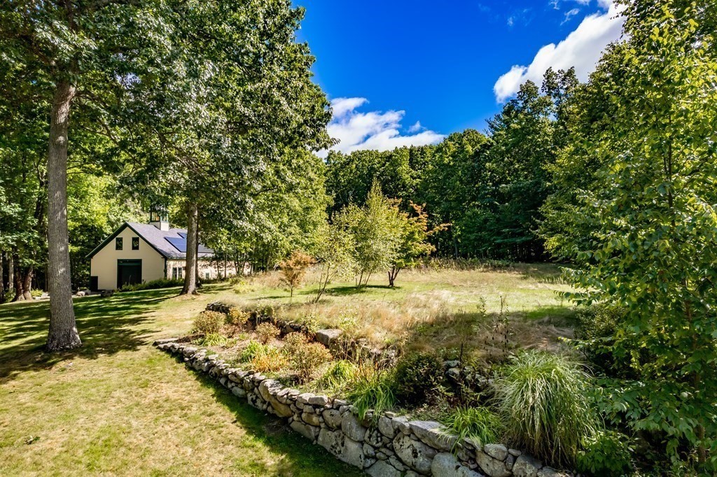 18 South Shaker Road Harvard, MA 01451 - Photo 24 of 36 a view of a yard with plants and large trees