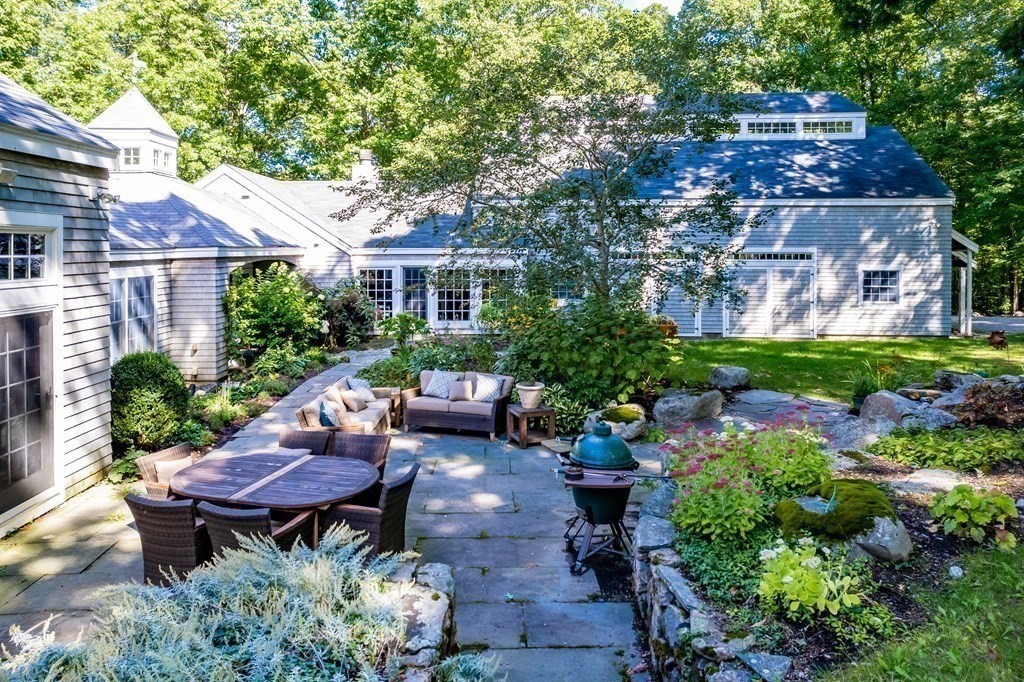 18 South Shaker Road Harvard, MA 01451 - Photo 28 of 36 a view of a backyard with sitting area and garden