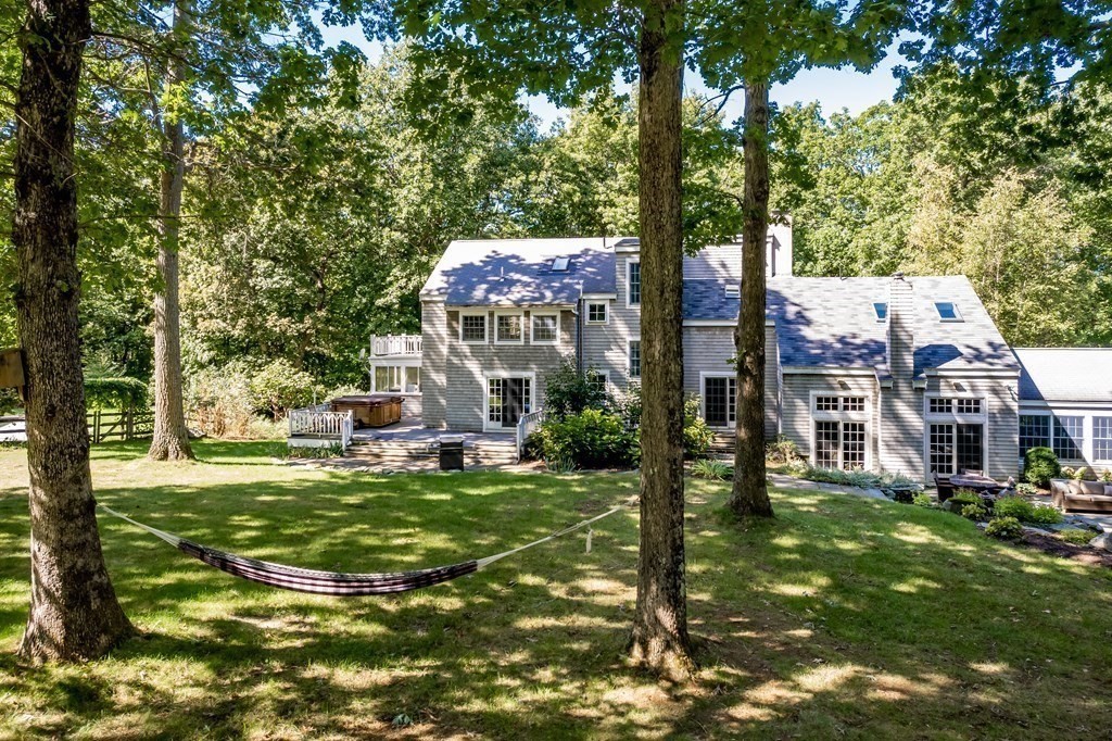 18 South Shaker Road Harvard, MA 01451 - Photo 31 of 36 a front view of a house with a garden and trees