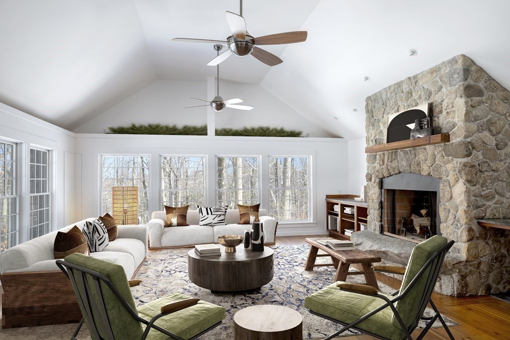 18 South Shaker Road Harvard, MA 01451 - Photo 6 of 36 a living room with furniture a fireplace and a chandelier