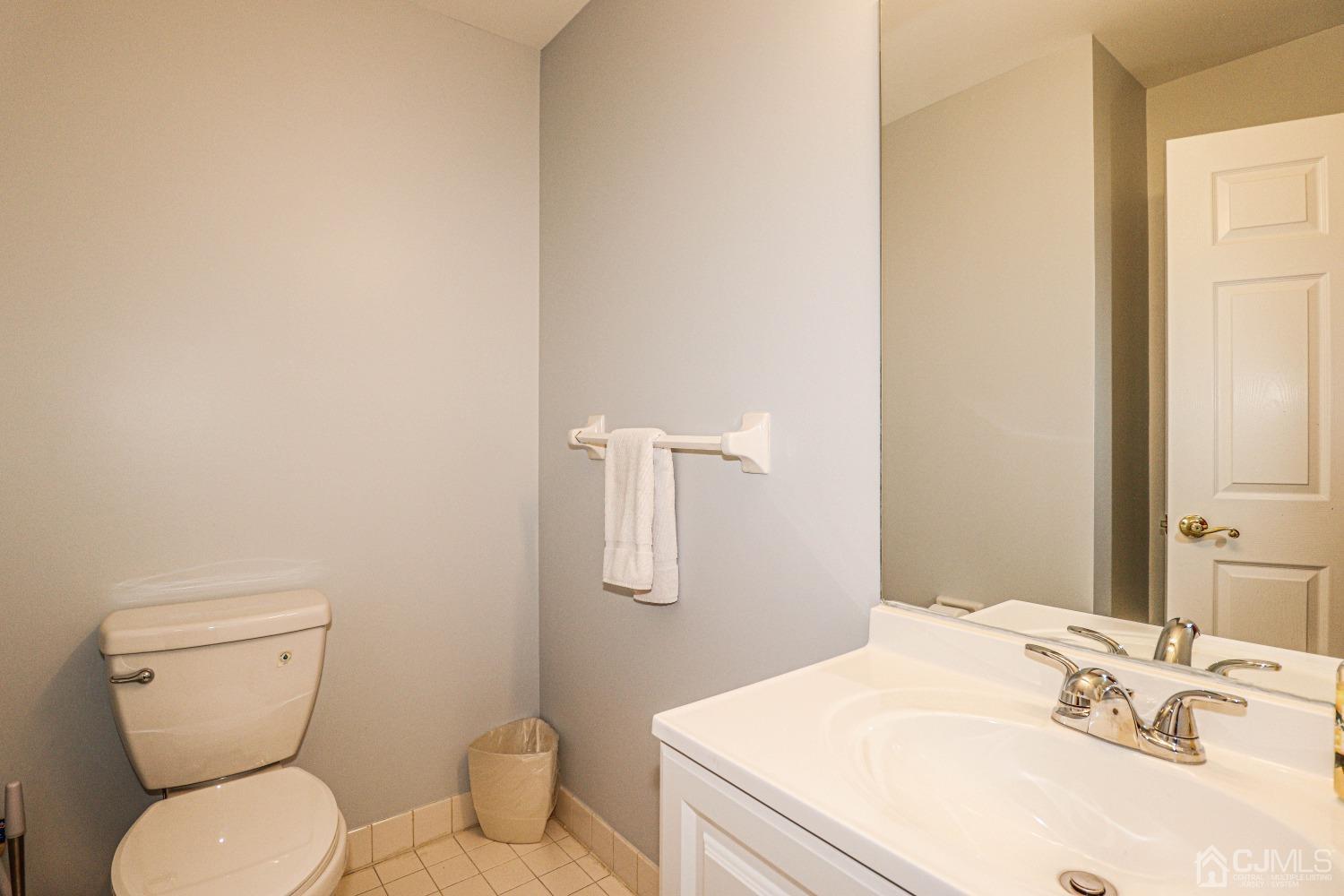 8 Prestwick Way Edison, NJ 08820 - Photo 15 of 27 a bathroom with a sink a toilet and mirror