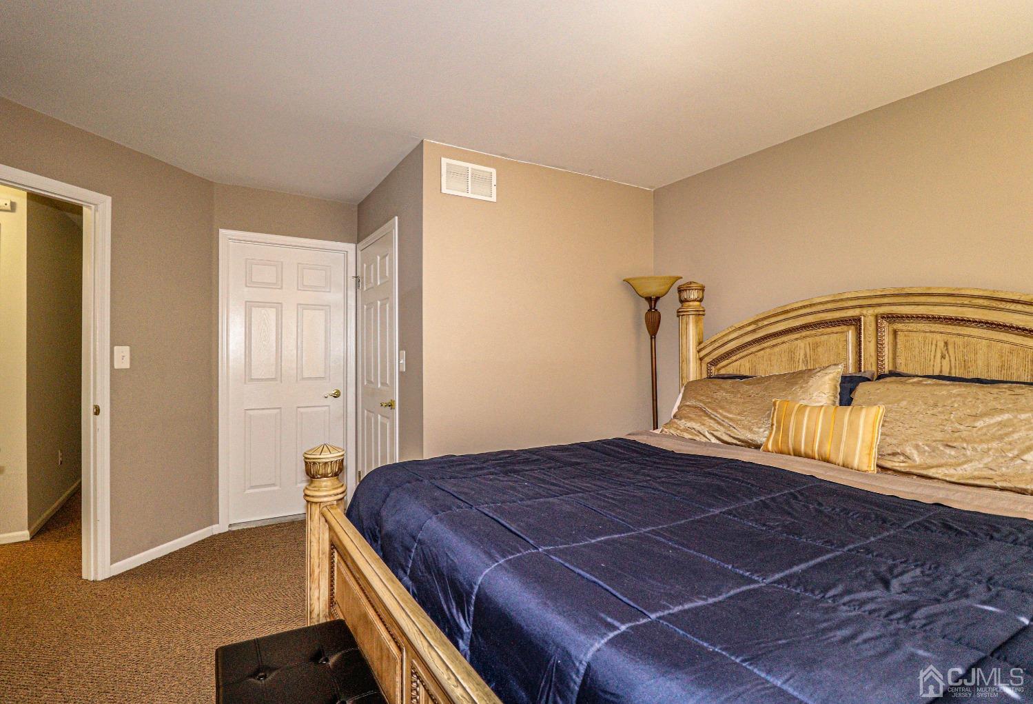 8 Prestwick Way Edison, NJ 08820 - Photo 17 of 27 a bedroom with a bed and wooden floor