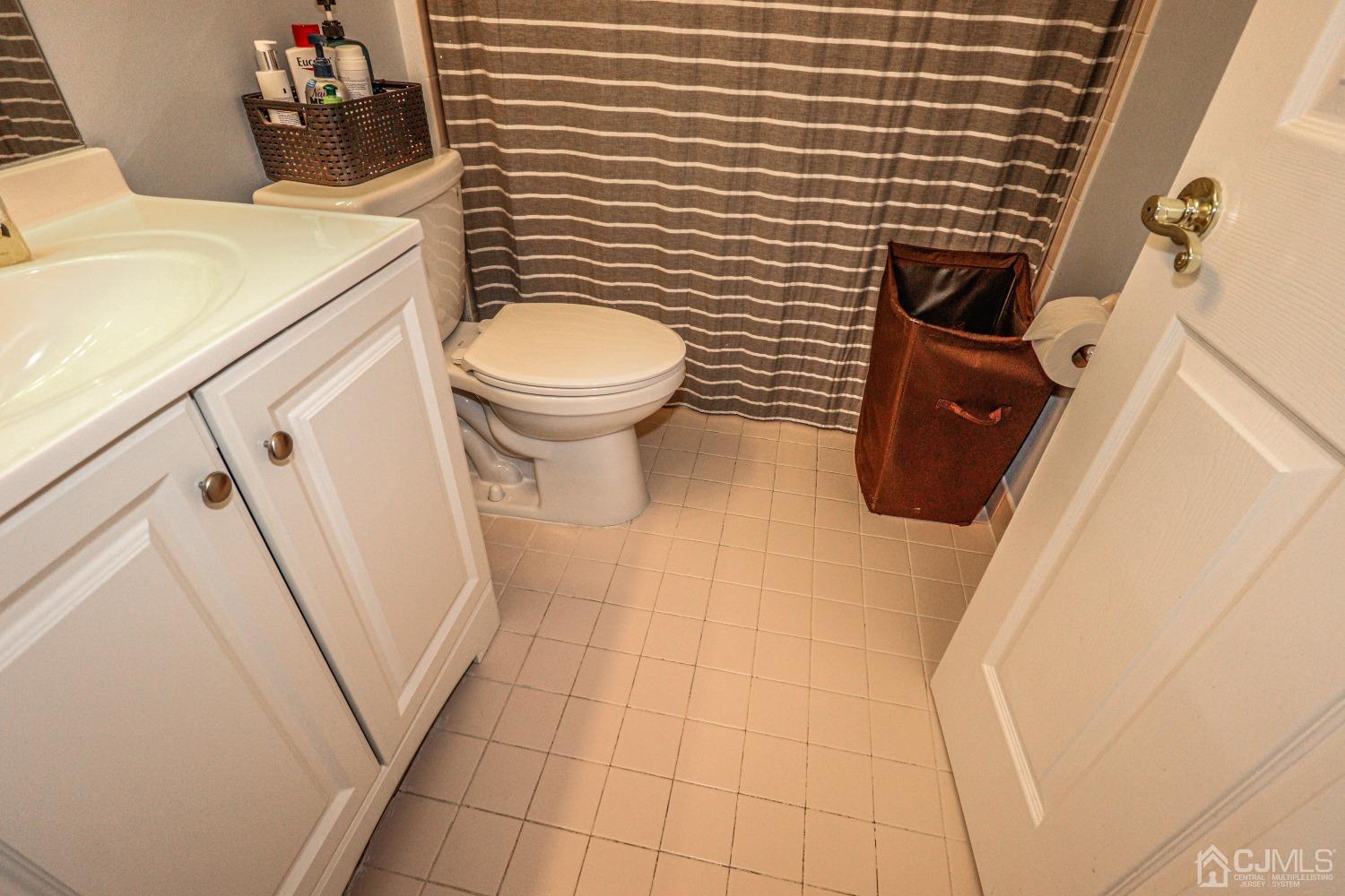8 Prestwick Way Edison, NJ 08820 - Photo 23 of 27 a bathroom with a sink and toilet