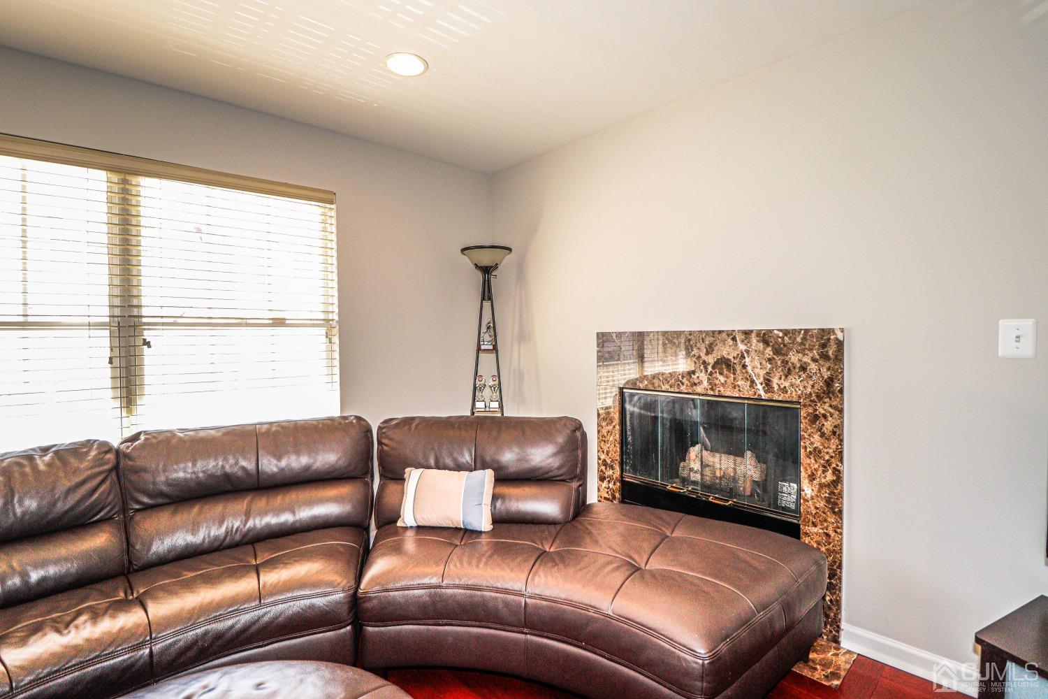 8 Prestwick Way Edison, NJ 08820 - Photo 4 of 27 a living room with a couch and a fireplace