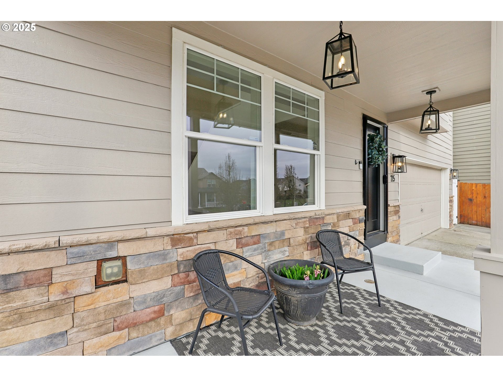 715 North 16th Court Ridgefield, WA 98642 - Photo 4 of 46 a view of a patio with table and chairs and potted plants