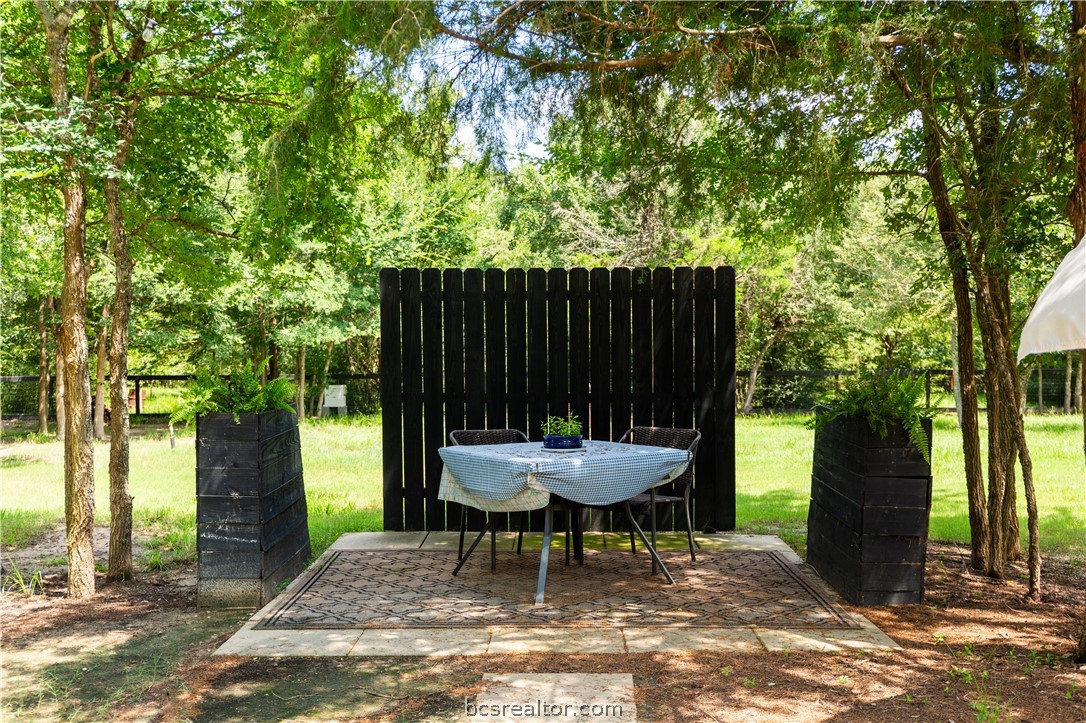 5036 Glory Road Bryan, TX 77808 - Photo 46 of 50 Outside dining area, ample shade and trees