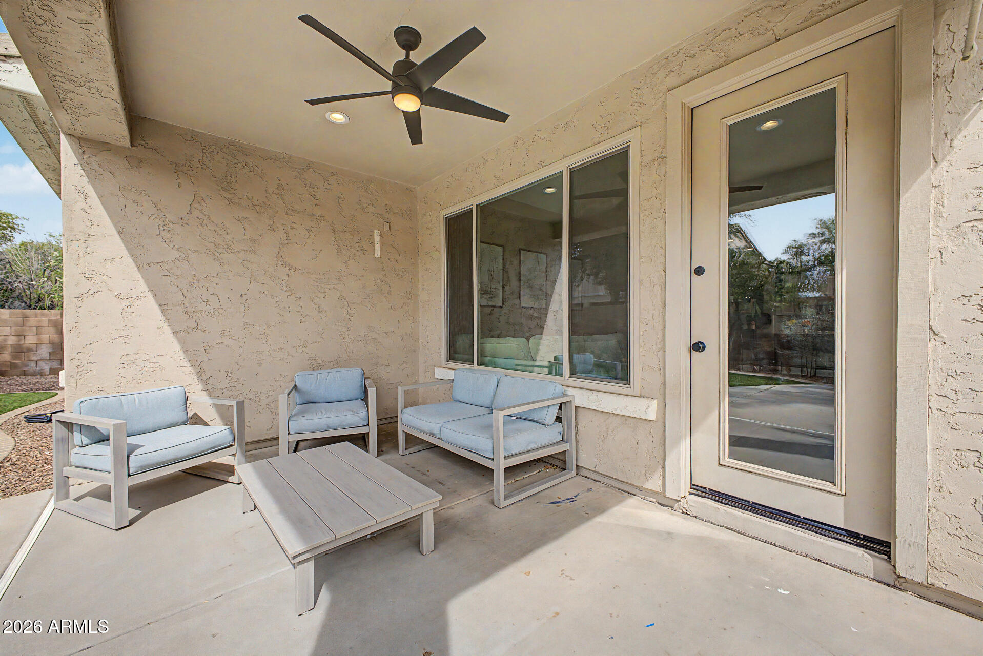 4272 East Buckboard Road Gilbert, AZ 85297 - Photo 33 of 37 a living room with furniture and a window