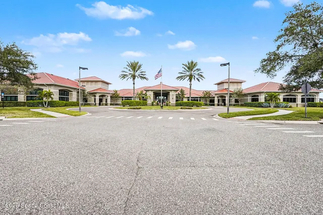 a view of swimming pool with outdoor seating and plants