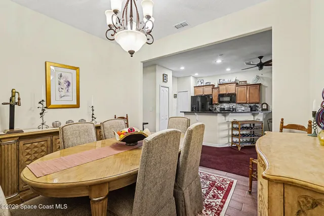 a kitchen with stainless steel appliances granite countertop a refrigerator and microwave