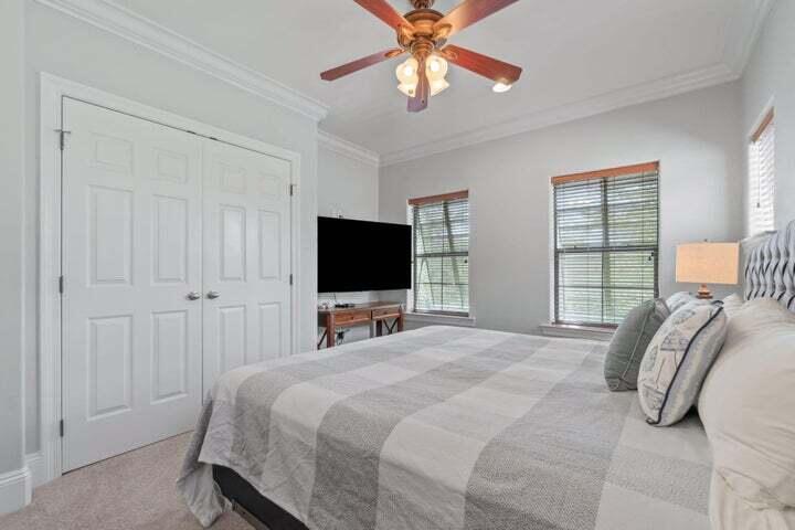 1900 Baytowne Loop Miramar Beach, FL 32550 - Photo 29 of 44 a bedroom with a bed and a flat screen tv