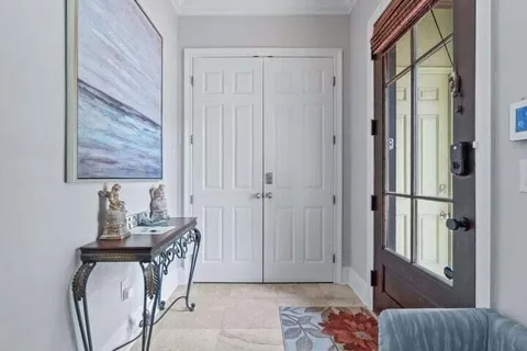 a bedroom with furniture and a window