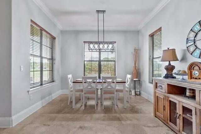 a view of a dining room with furniture window and outside view