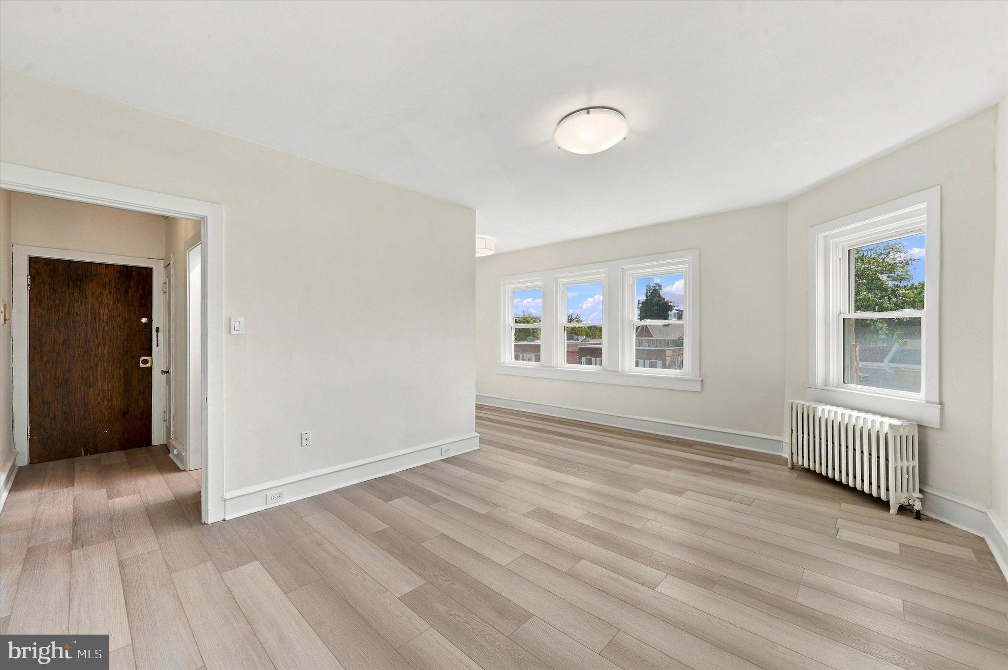 20 Rittenhouse Place, Unit 3 Ardmore, PA 19003 - Photo 9 of 16 Sun filled, large family room