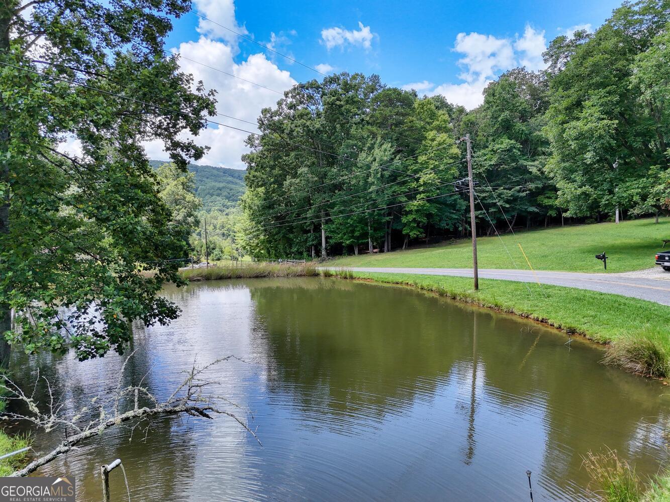 3291 Moccasin Creek Road Murphy, NC 28906 - Photo 11 of 78 a view of a lake with a yard and swimming pool