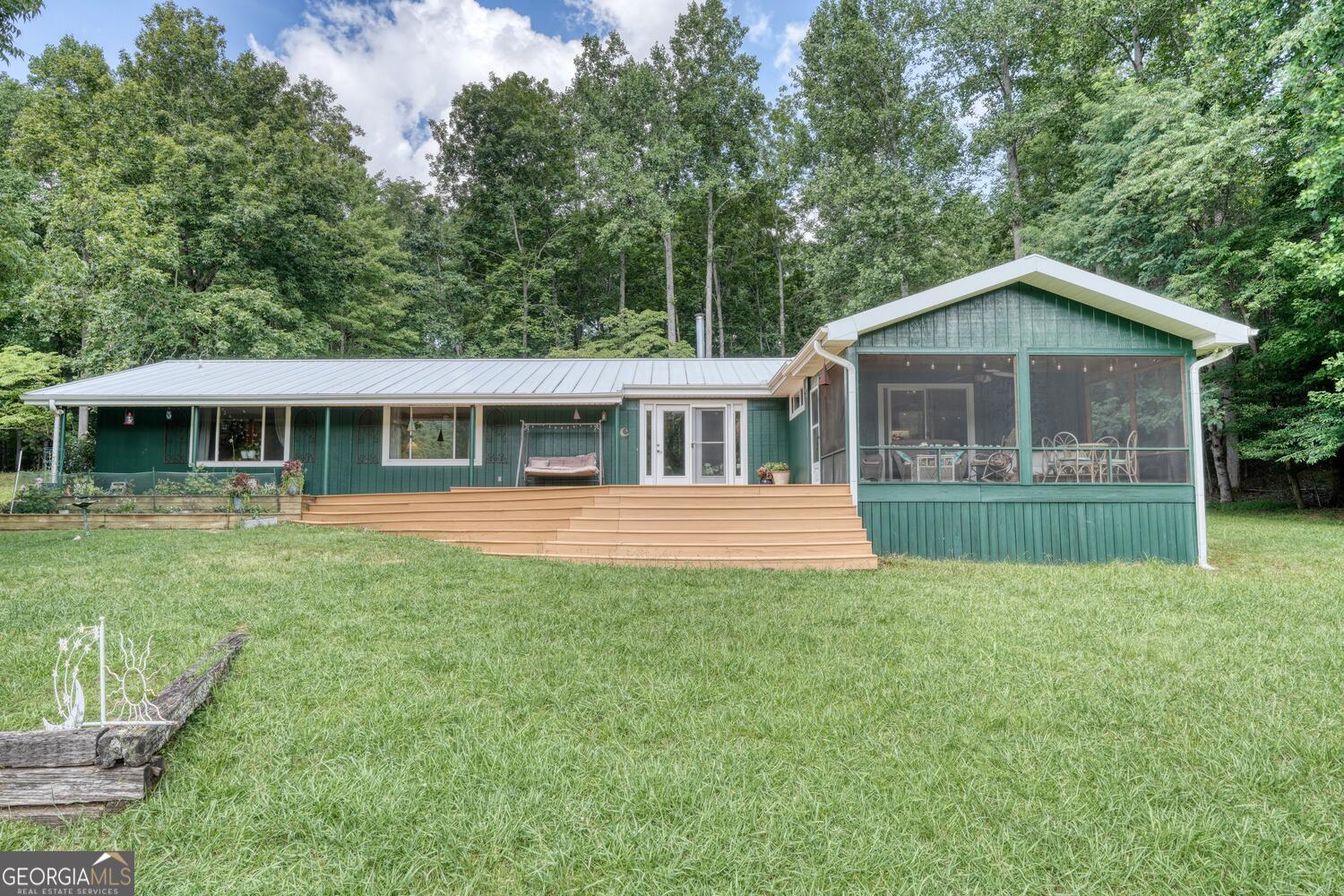3291 Moccasin Creek Road Murphy, NC 28906 - Photo 14 of 78 a front view of a house with a yard