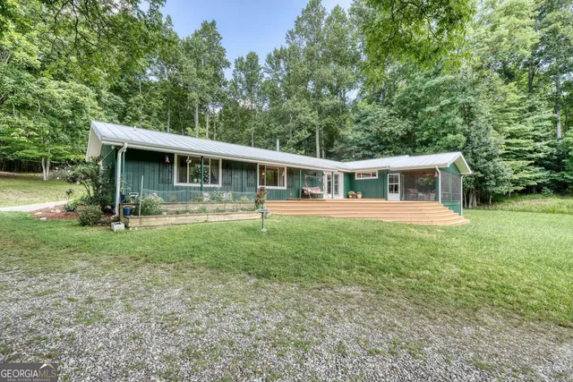 a view of a livingroom with furniture and a workspace