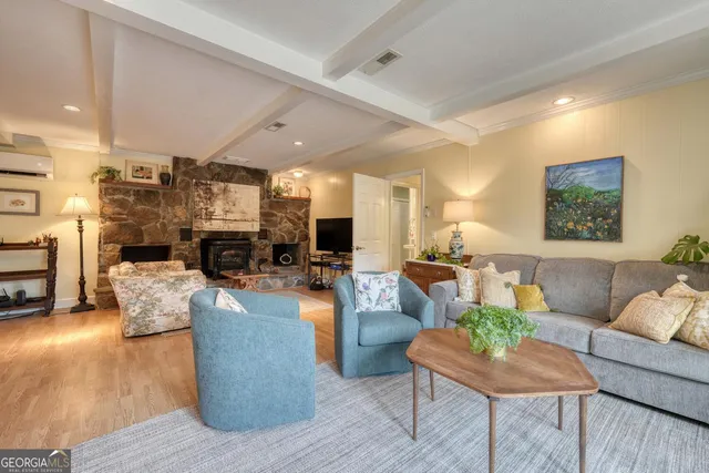 a bed room with a bed and a mirror on a dresser