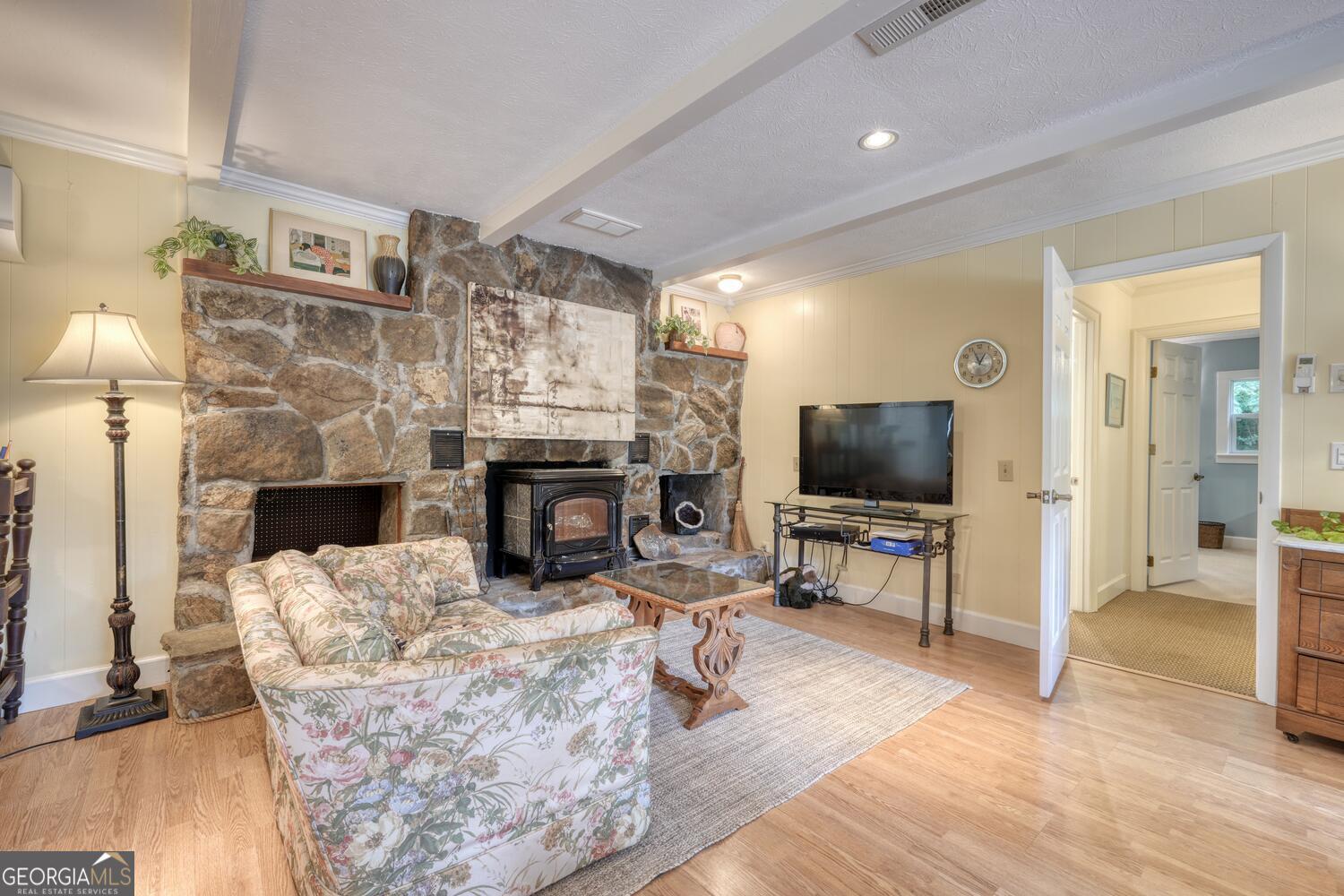 3291 Moccasin Creek Road Murphy, NC 28906 - Photo 21 of 78 a living room with furniture a flat screen tv and a fireplace