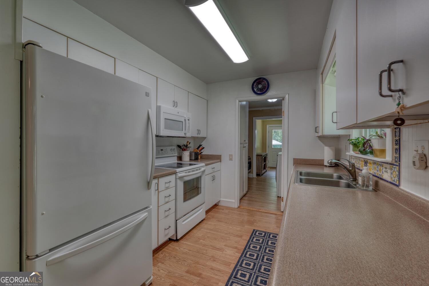 3291 Moccasin Creek Road Murphy, NC 28906 - Photo 26 of 78 a kitchen with stainless steel appliances granite countertop a refrigerator and a stove top oven
