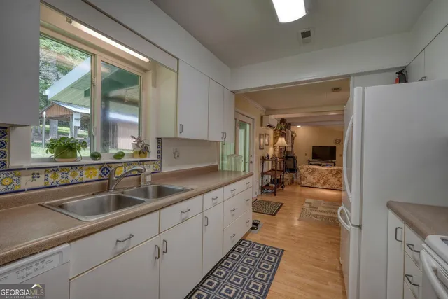 a utility room with sink dryer and washer
