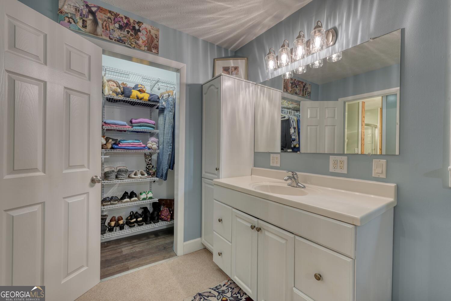 3291 Moccasin Creek Road Murphy, NC 28906 - Photo 32 of 78 a spacious bathroom with a double vanity sink and a mirror