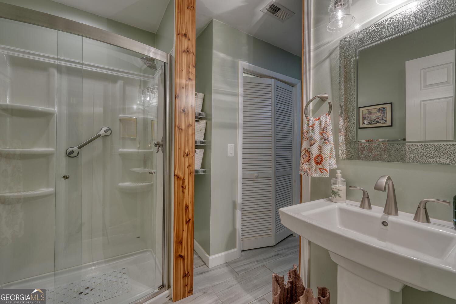 3291 Moccasin Creek Road Murphy, NC 28906 - Photo 33 of 78 a bathroom with a sink and a mirror