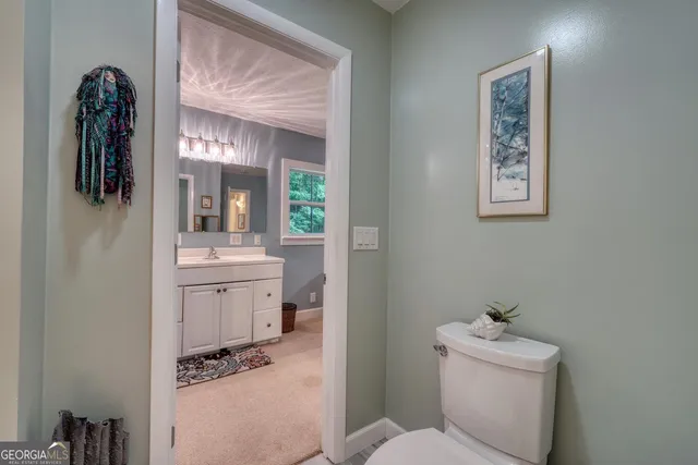 a view of a patio with couches table and chairs and potted plants
