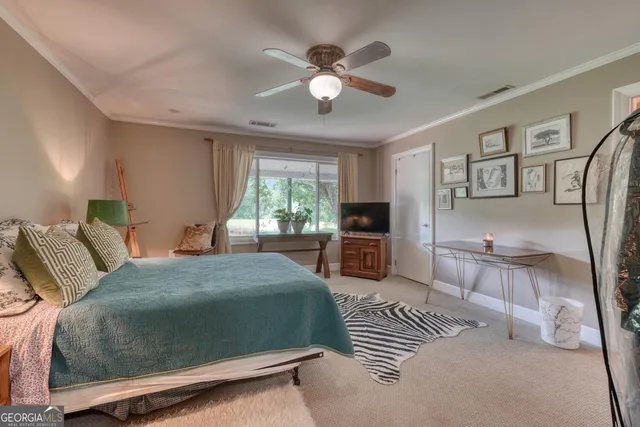 a view of backyard with large trees and wooden fence
