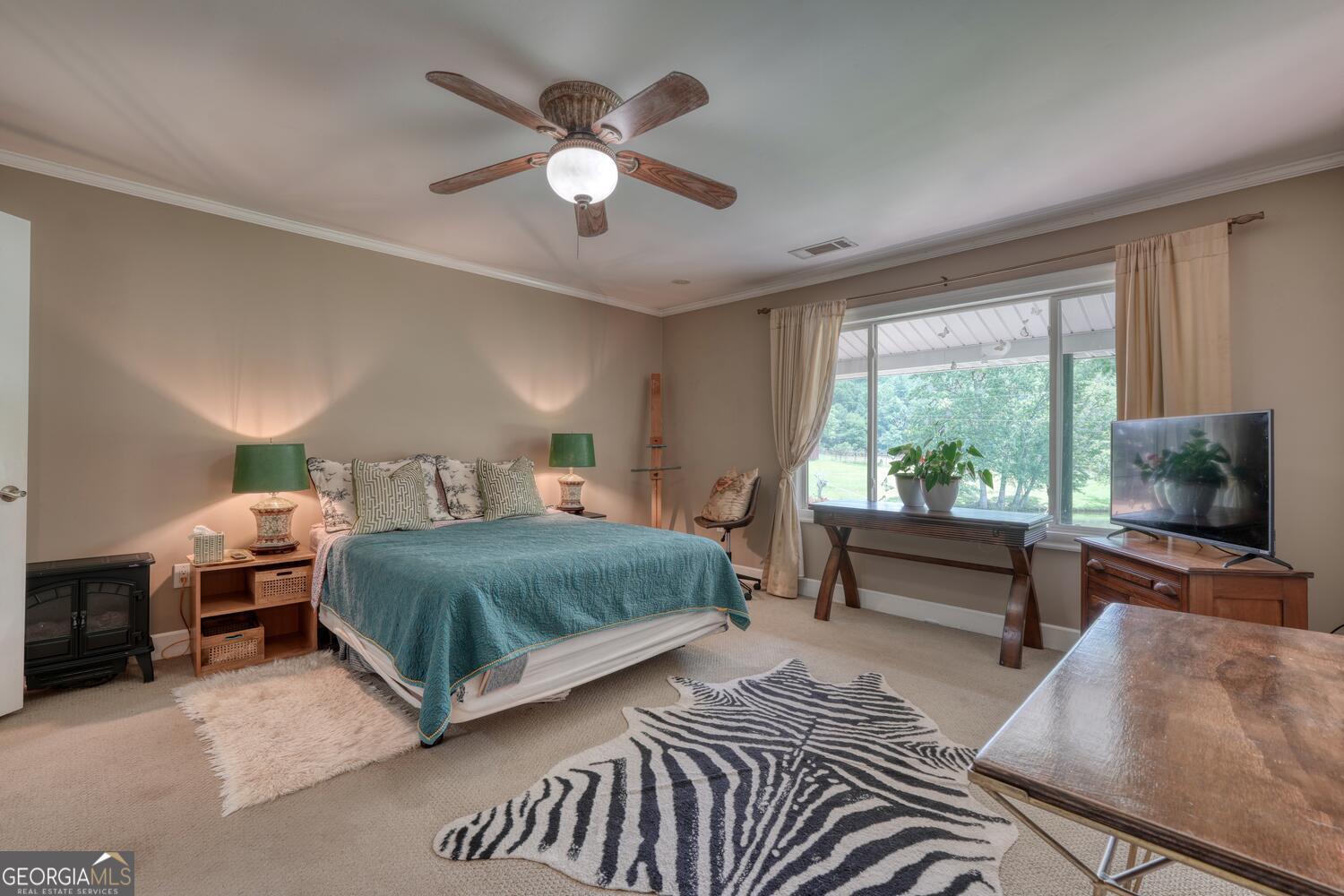 3291 Moccasin Creek Road Murphy, NC 28906 - Photo 46 of 78 a bedroom with a bed and a chandelier