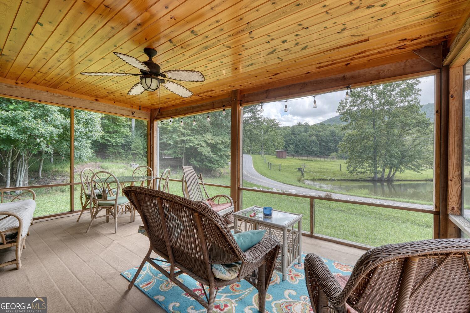3291 Moccasin Creek Road Murphy, NC 28906 - Photo 48 of 78 a view of a patio with a table chairs and a backyard