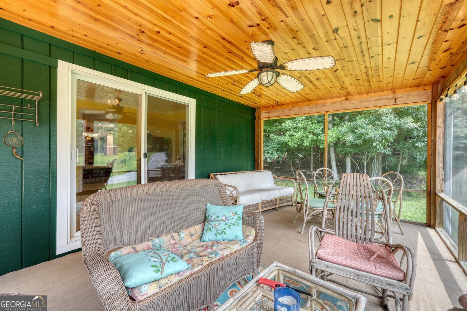 3291 Moccasin Creek Road Murphy, NC 28906 - Photo 49 of 78 a view of a patio with couches table and chairs and potted plants