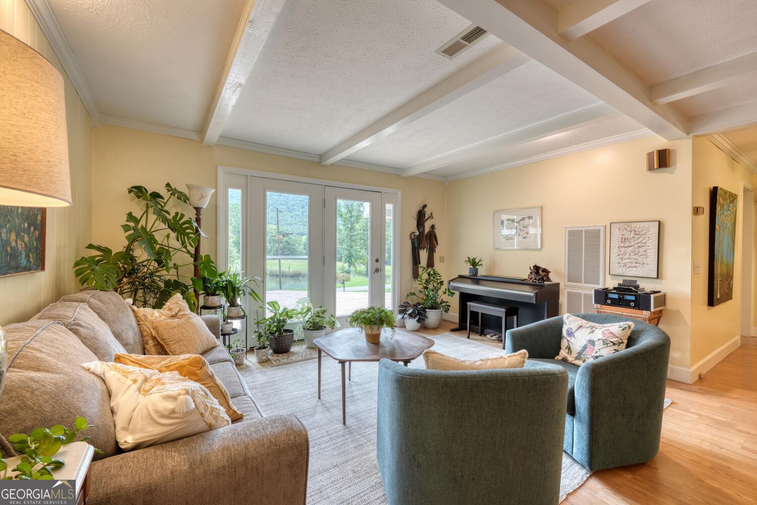 3291 Moccasin Creek Road Murphy, NC 28906 - Photo 6 of 78 a living room with furniture and a floor to ceiling window