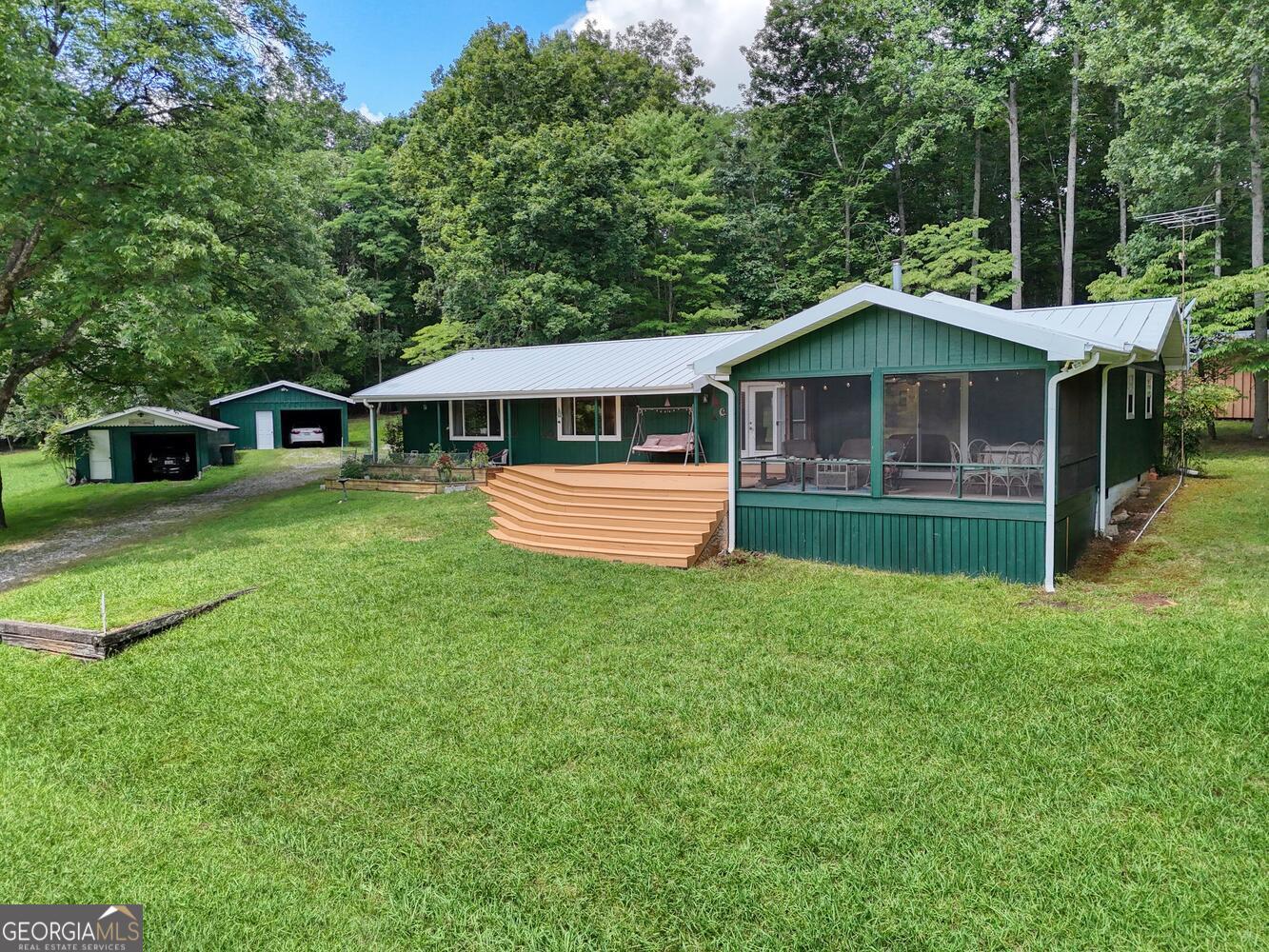 3291 Moccasin Creek Road Murphy, NC 28906 - Photo 63 of 78 a front view of a house with a yard and green space