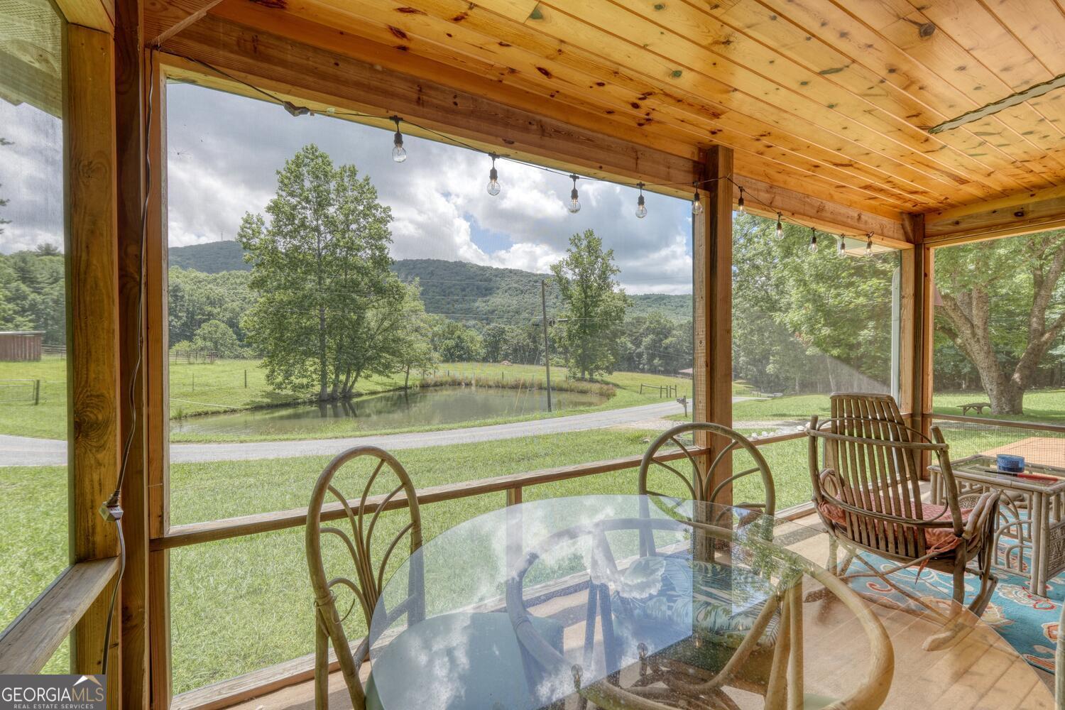 3291 Moccasin Creek Road Murphy, NC 28906 - Photo 8 of 78 a view of a room with balcony and furniture