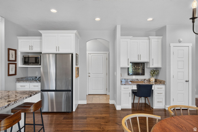 1263 East 1200th South Springville, UT 84663 - Photo 13 of 60 Modern kitchen space featuring white shaker cabinetry, stainless steel refrigerator, granite countertops, and wood-finish flooring