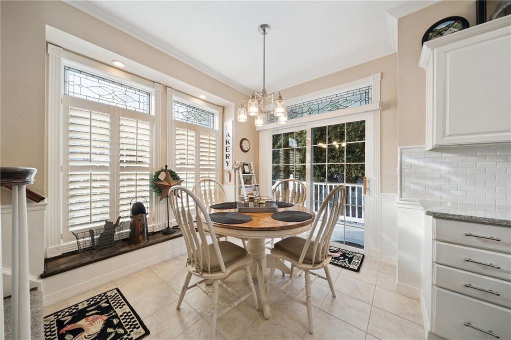404 Beech Street Gibsonia, PA 15044 - Photo 11 of 32 a dining room with furniture large windows and a chandelier