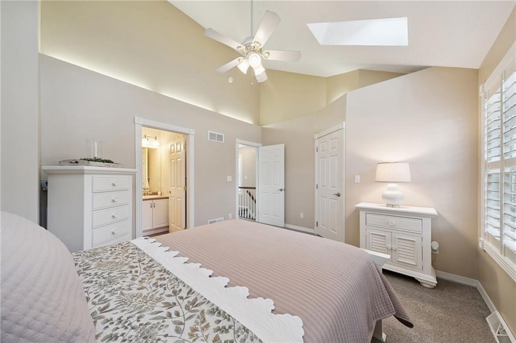 404 Beech Street Gibsonia, PA 15044 - Photo 15 of 32 a bedroom with a bed and a chandelier